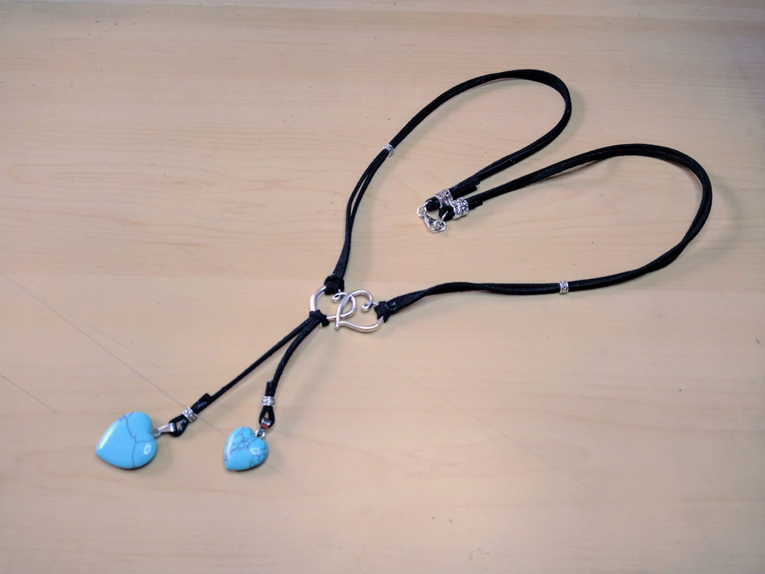 Leather necklace with heart charms